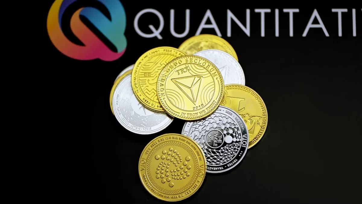 a pile of coins sitting on top of a black table