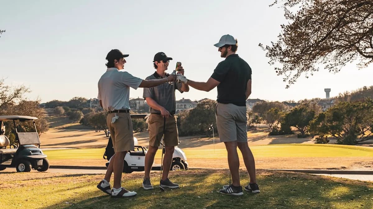 man in black t-shirt and brown shorts playing golf during daytime
