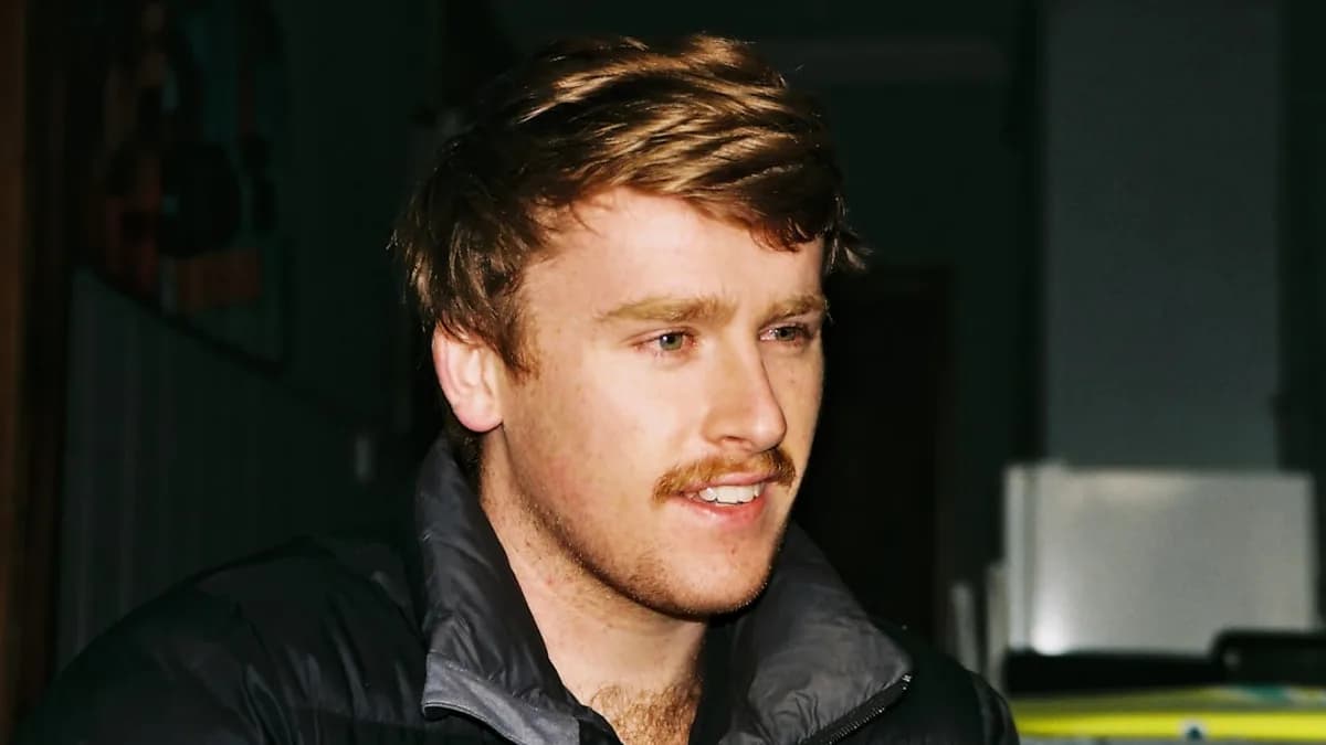 man in black zip up jacket