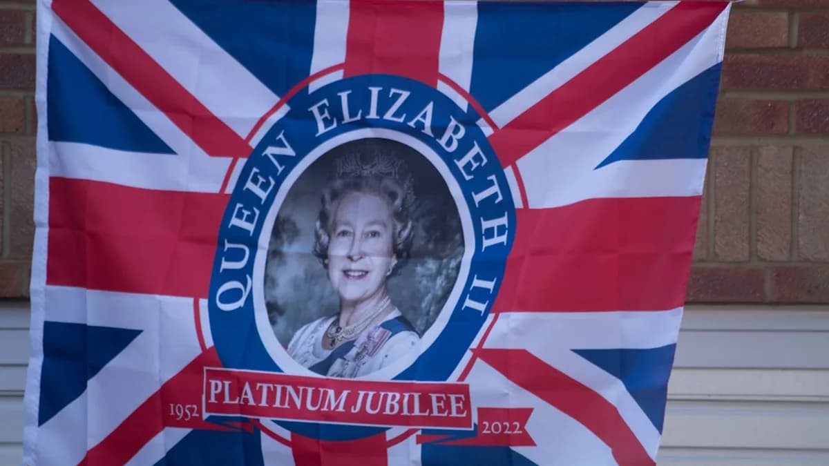 a flag with a picture of queen elizabeth on it