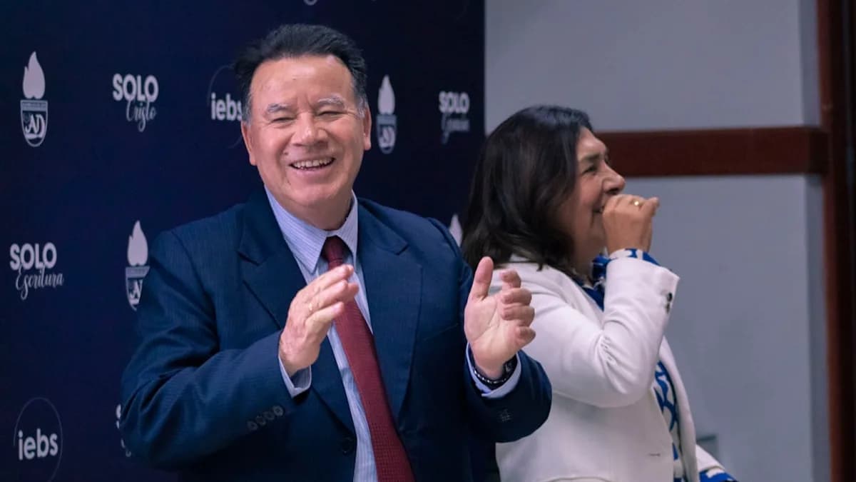 A man and a woman standing in front of a microphone