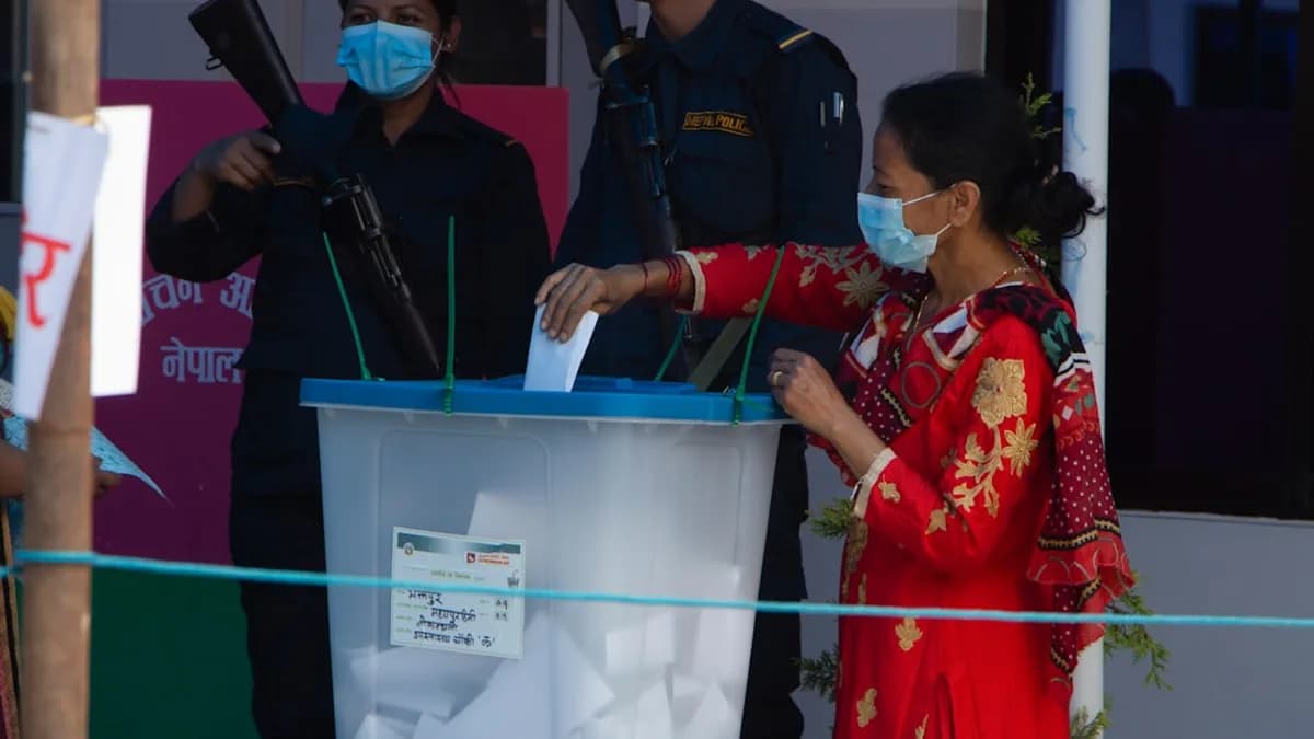 a woman in a red dress and a man in a mask holding a microphone