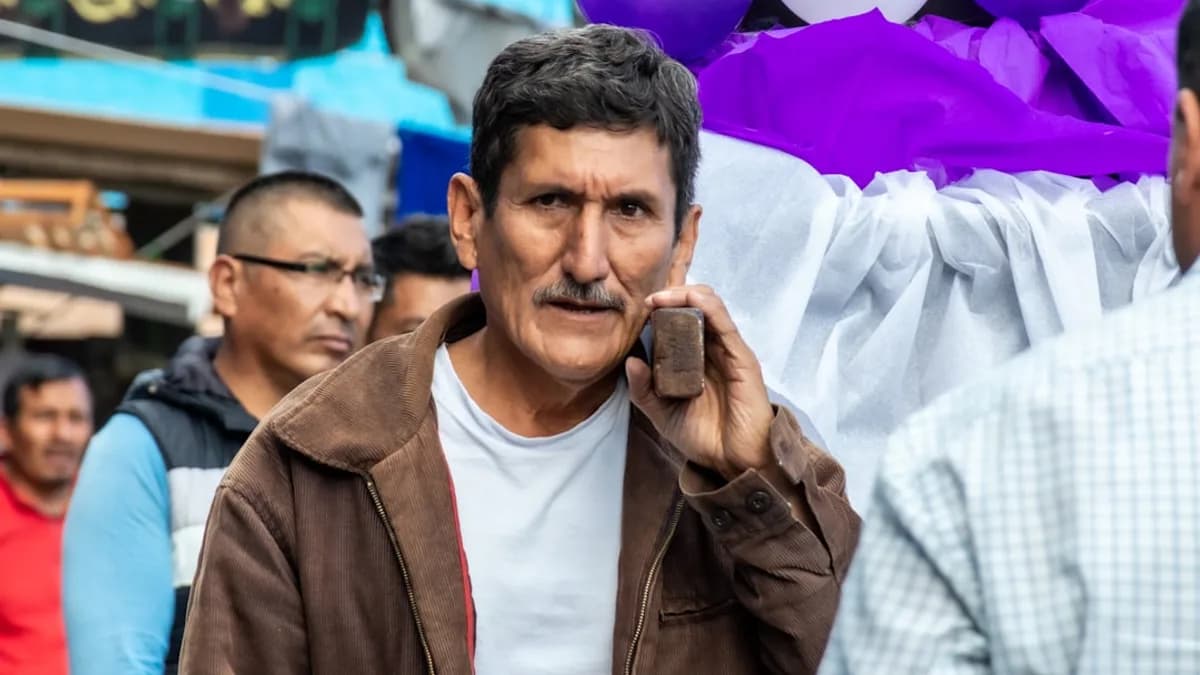 a man holding a cell phone to his ear