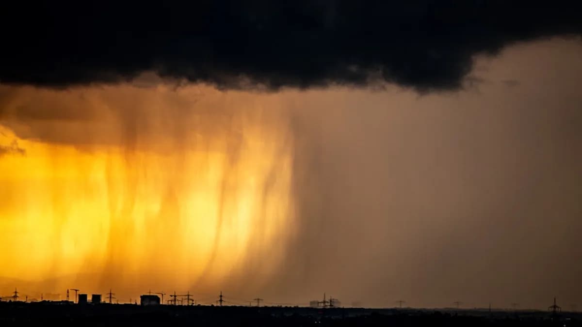 A large storm moving across a cloudy sky