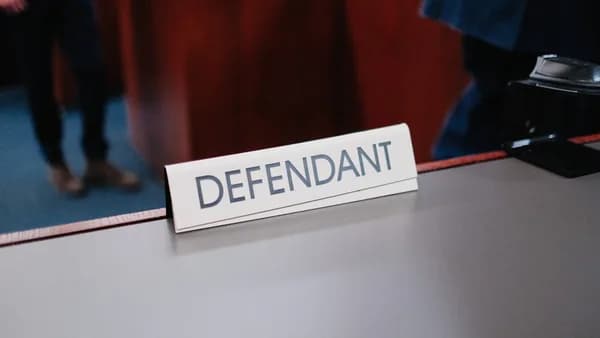 a desk with a sign on it that says defend