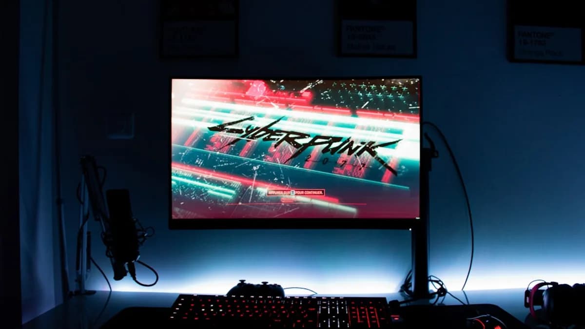 a computer monitor sitting on top of a desk