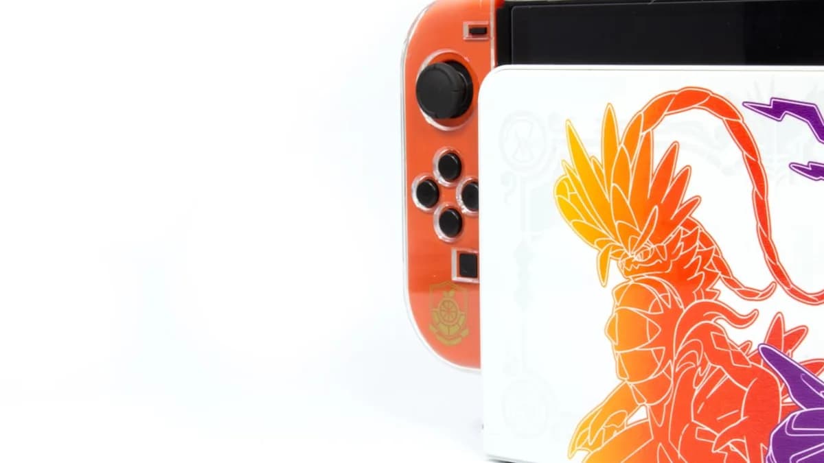a nintendo wii game system with a picture of a dragon on it