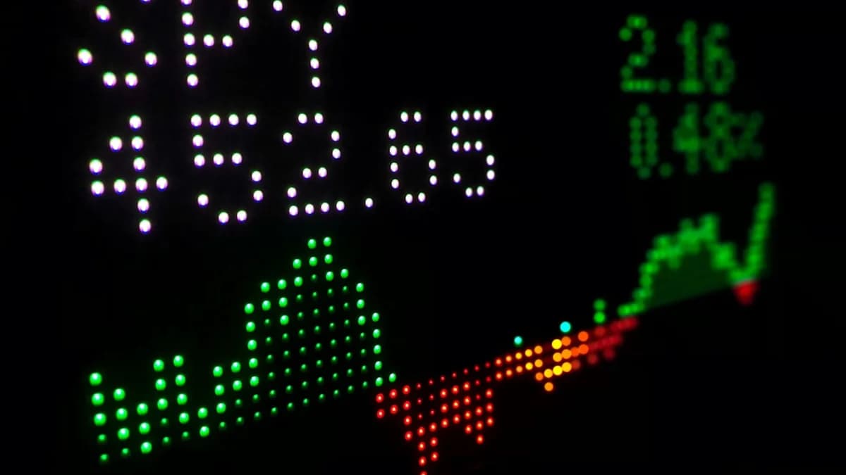 a close up of a clock with different colored numbers