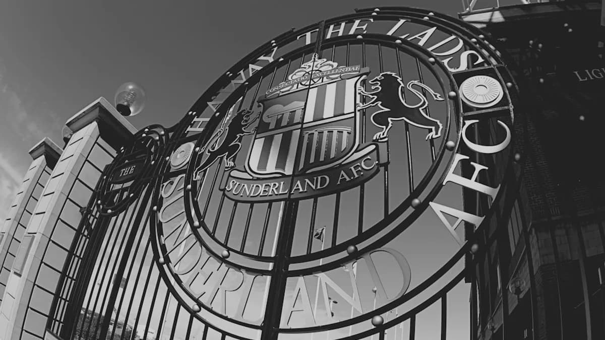 a clock hanging from the side of a building