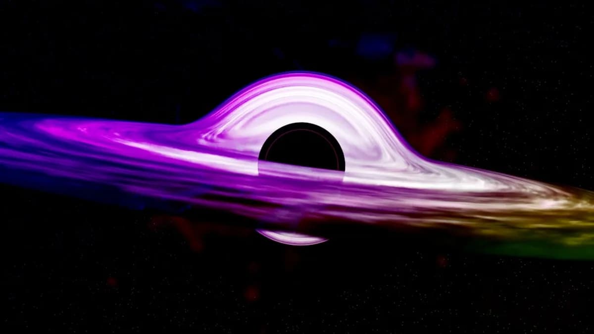 a purple and green object floating in the air