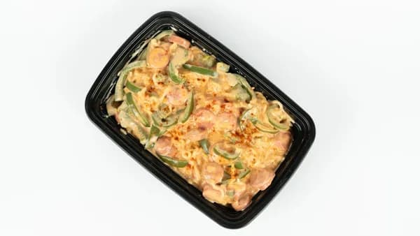 A black container filled with creamy pasta and green peppers.