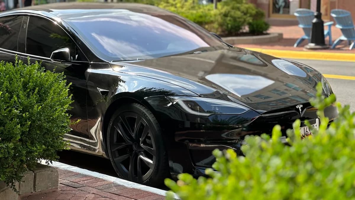 A black car parked on the side of the road