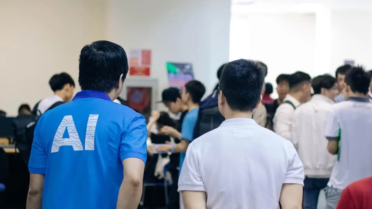man in white and blue crew neck t-shirt standing in front of people