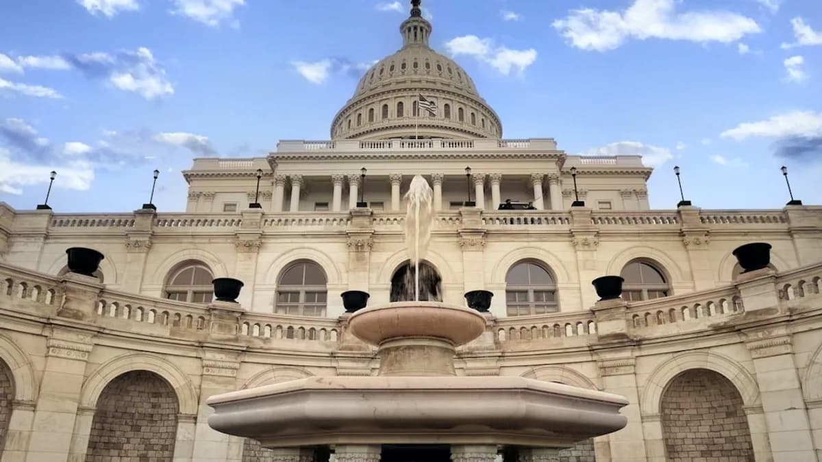 a large building with a fountain in front of it