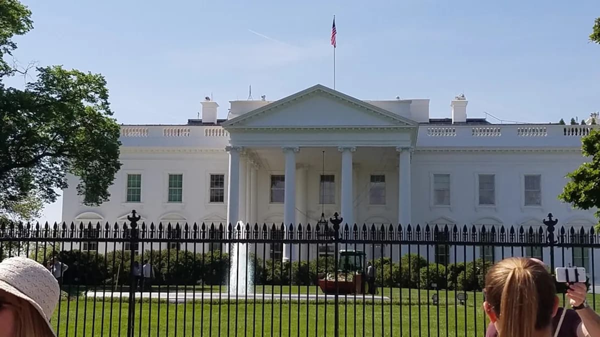 woman in black shirt sitting on black metal bench