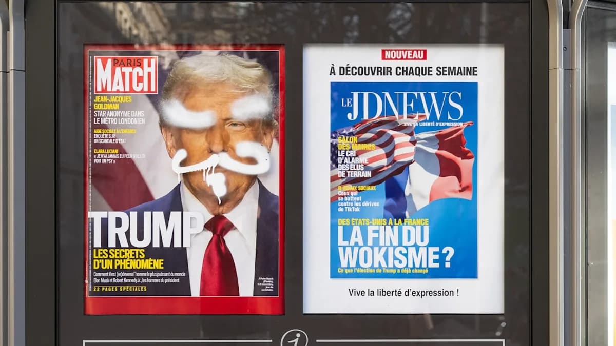 A newspaper dispenser on a city street