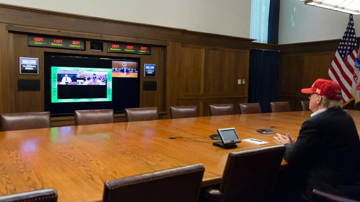 black flat screen tv turned on near brown wooden wall