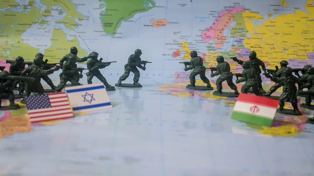 Toy soldiers face off on world map with flags.
