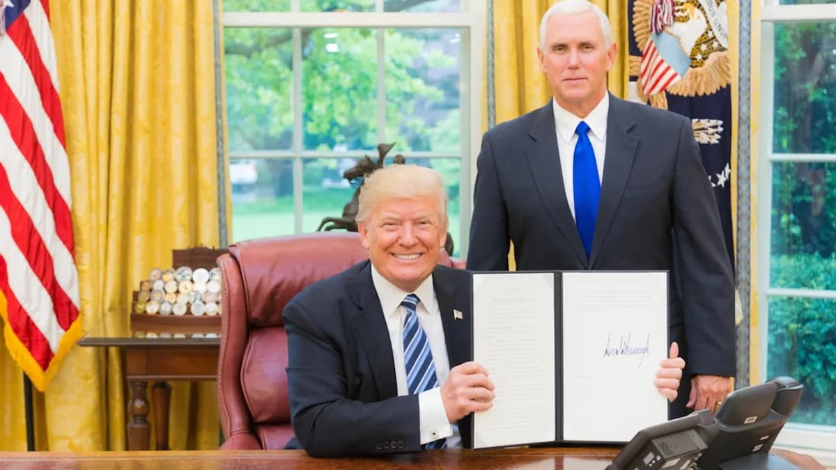 2 men in black suit sitting on red chair