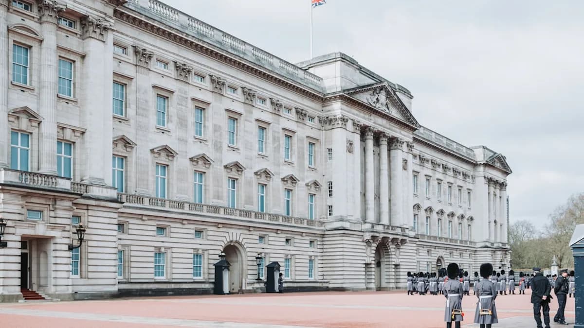 a large white building with a flag on top