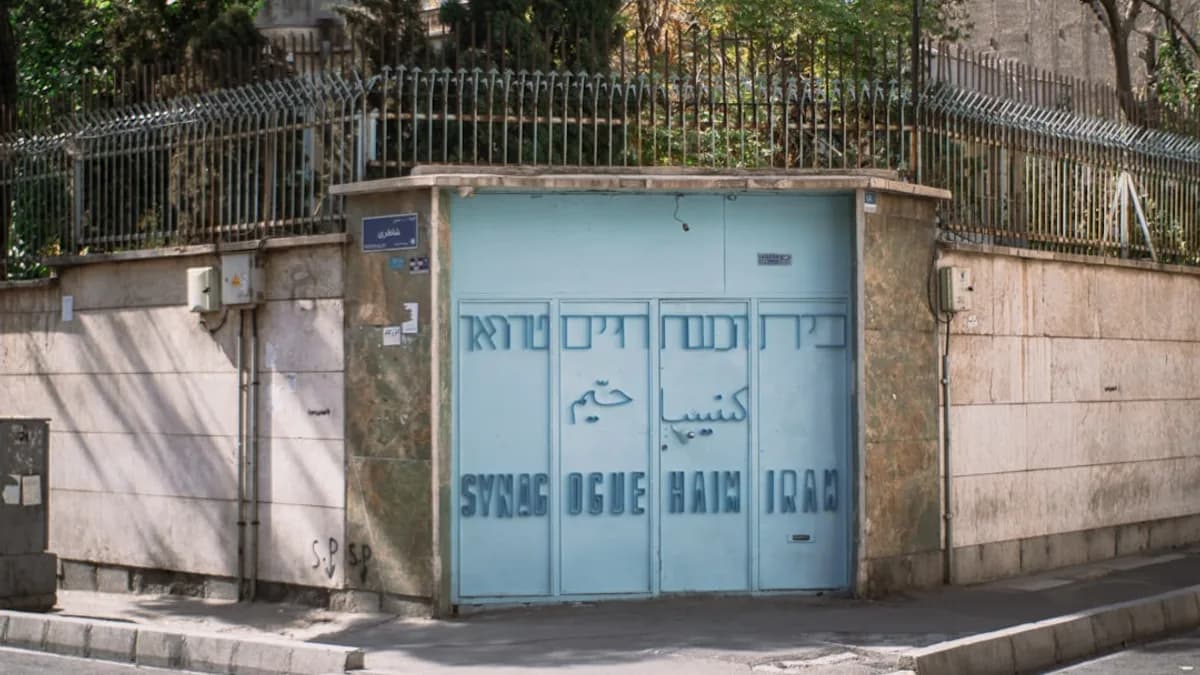 Light blue garage door with blue lettering.