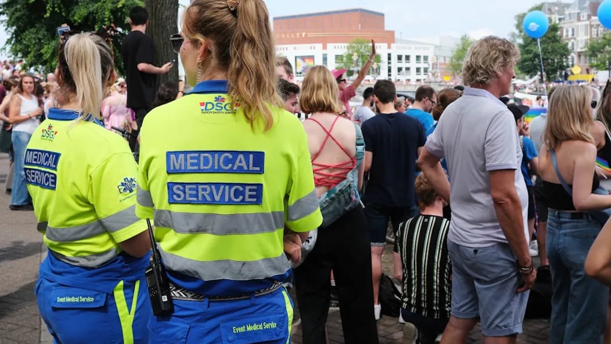 A group of people standing around each other