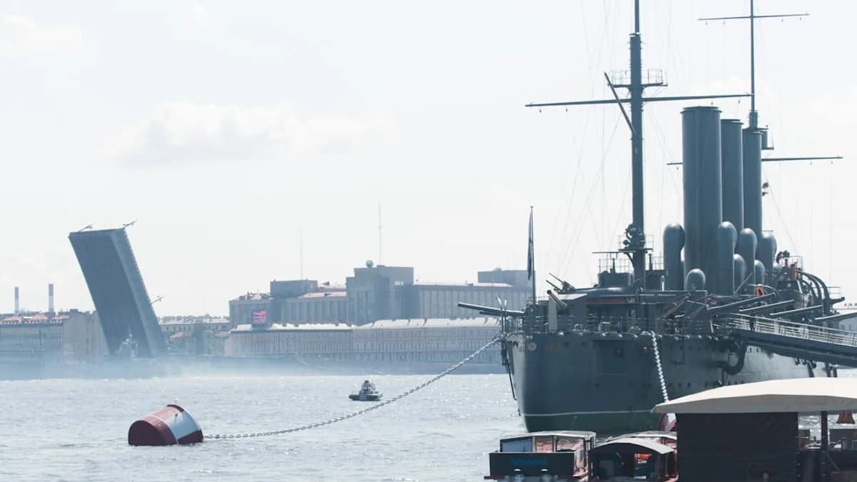 a large boat in the water next to a dock