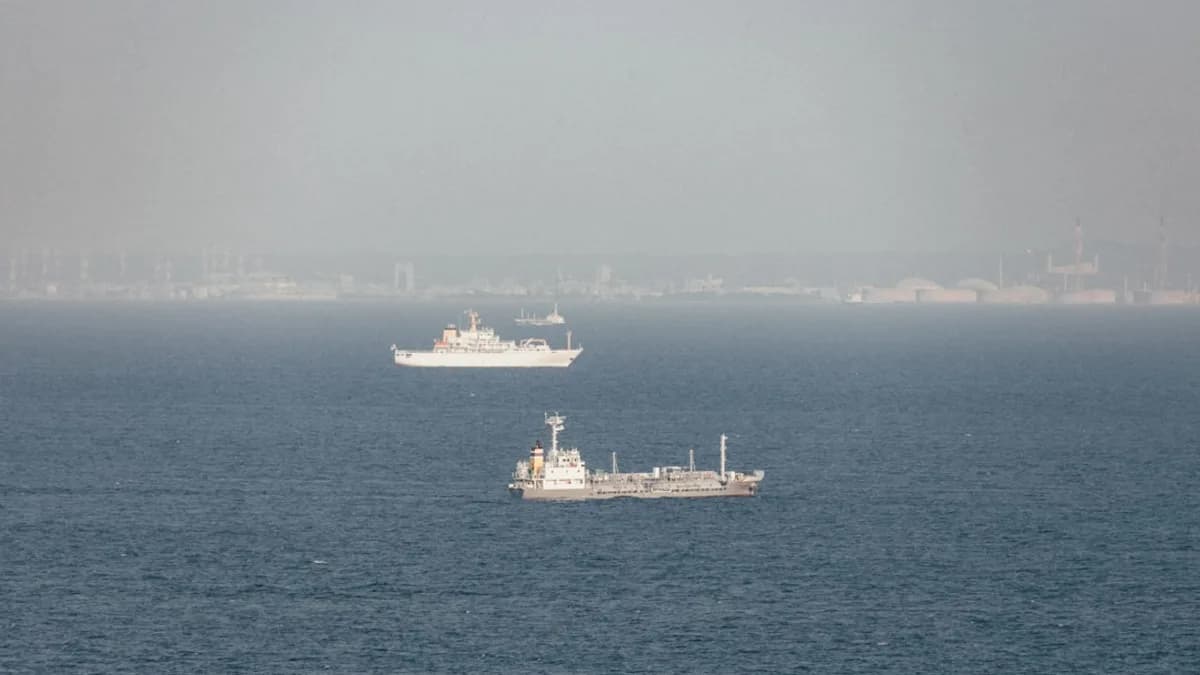 Two ships in the ocean on a foggy day