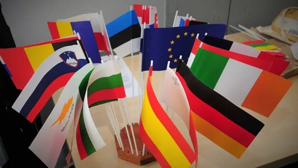 A bunch of flags that are on a table