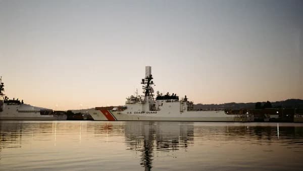 Coast guard ship docked in harbor at dusk