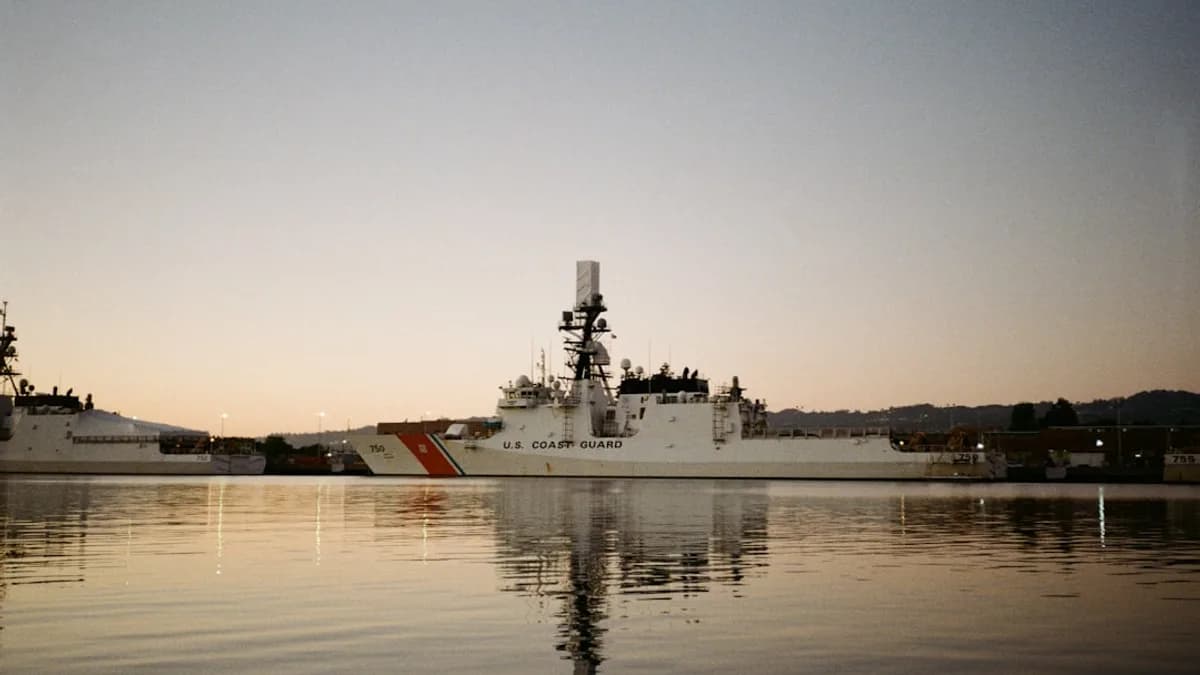 Coast guard ship docked in harbor at dusk