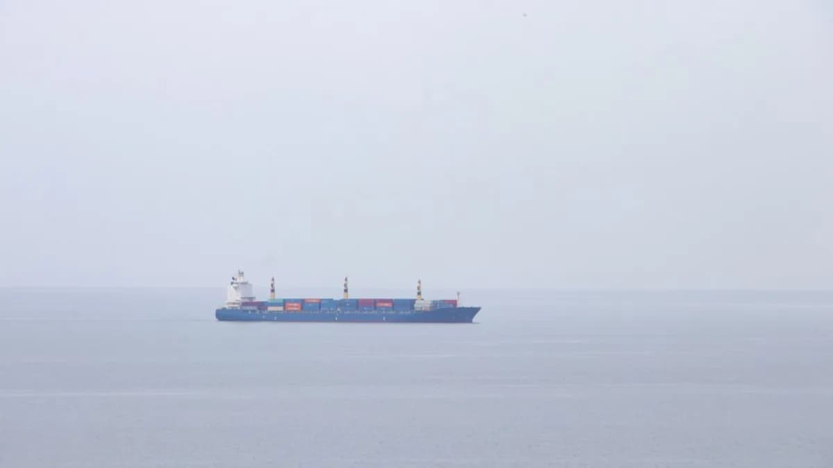 a large cargo ship in the middle of the ocean