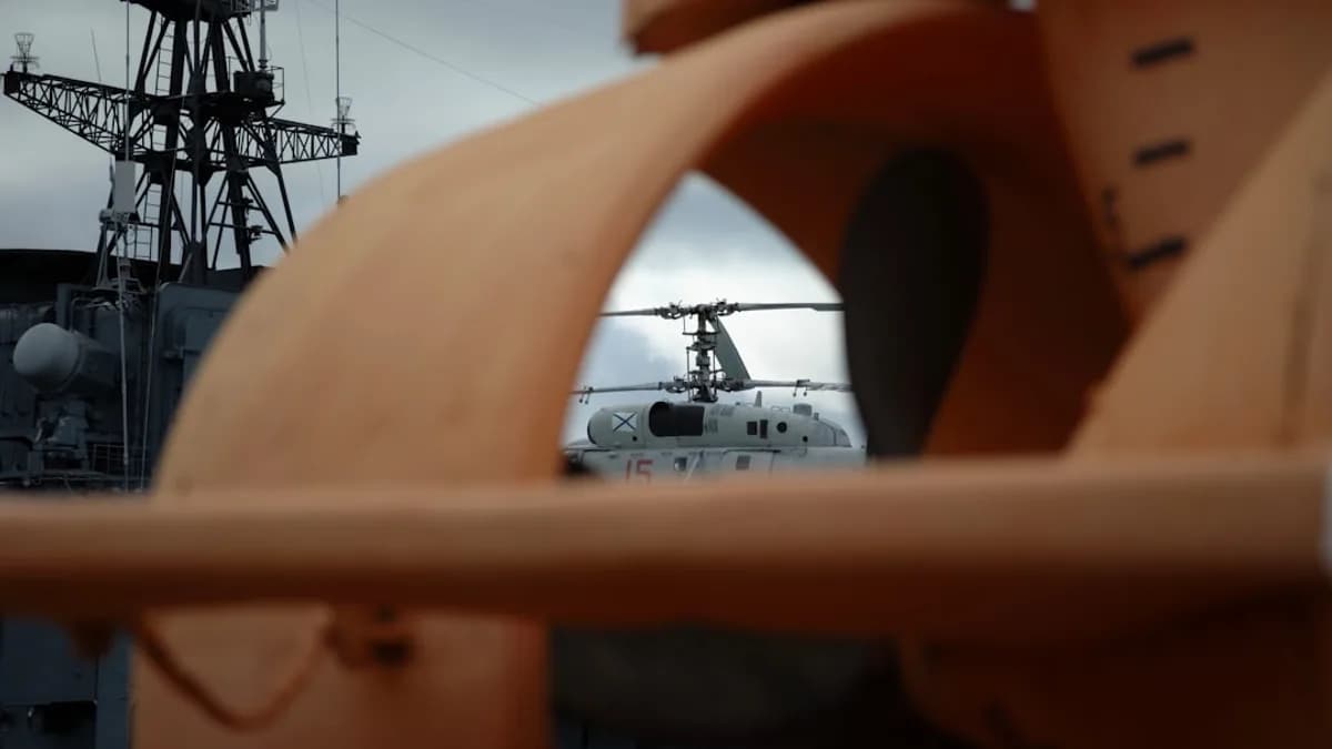 Helicopter seen through ship's propeller