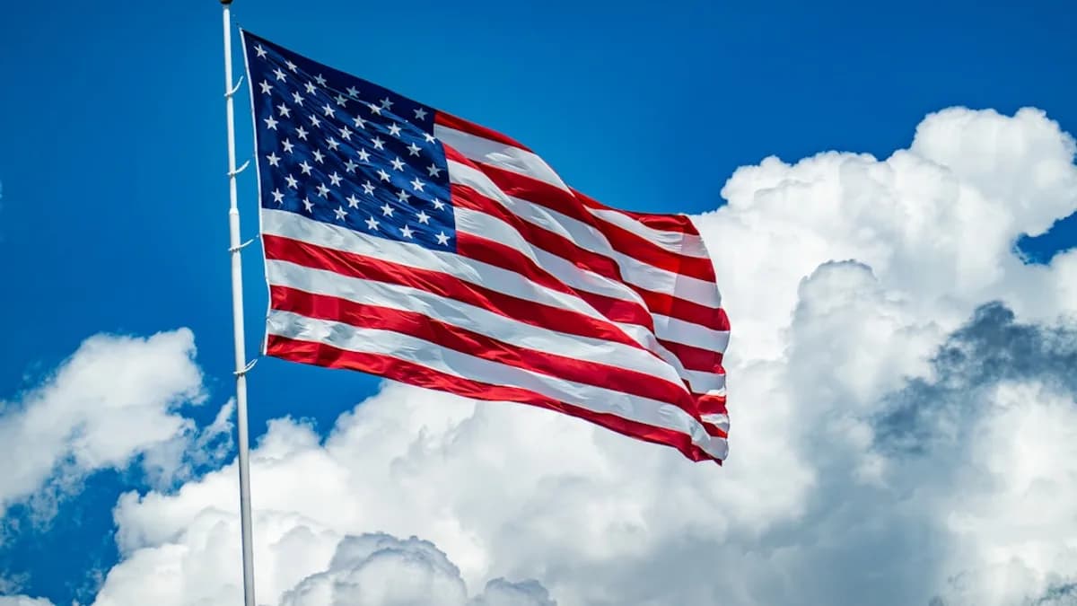 An american flag flying high in the sky