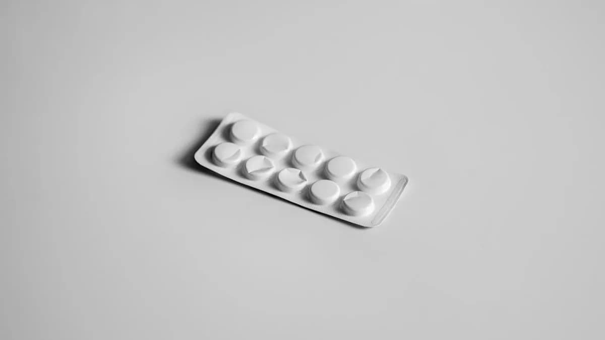 a white pill pill case sitting on top of a table