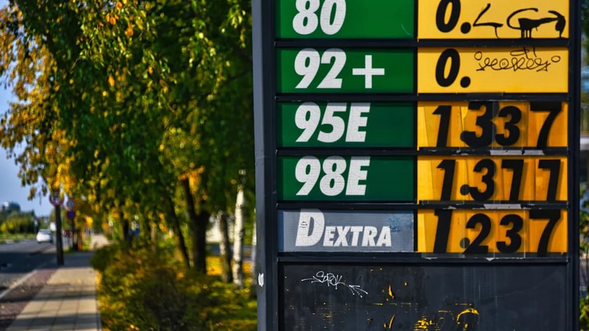 Gas prices displayed on a sign at a station.