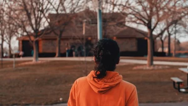 a person standing in front of a basketball hoop