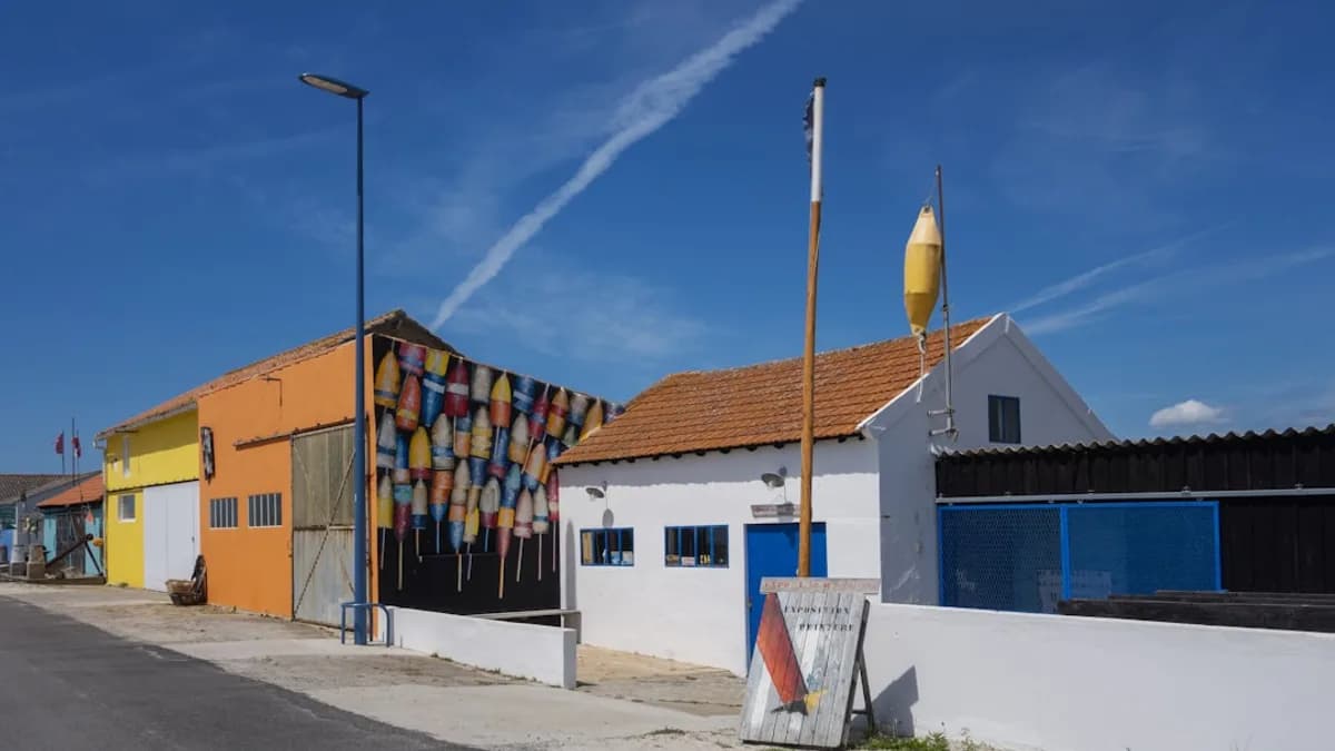 a row of buildings with a blue sky in the background