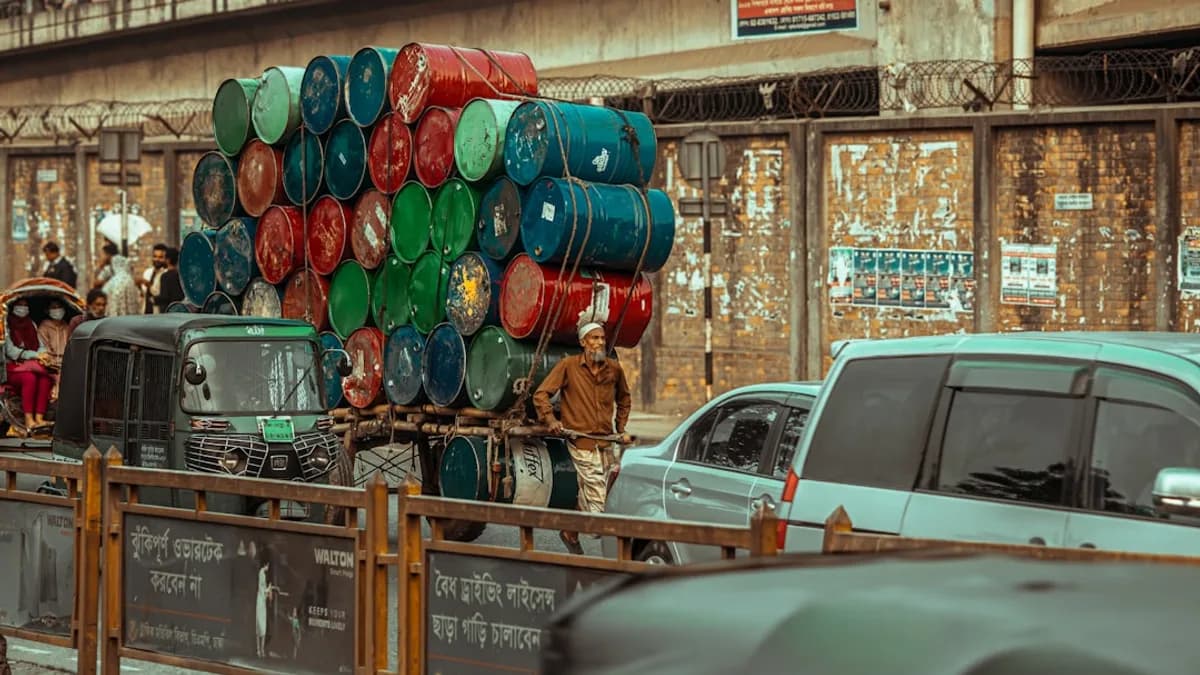 a truck carrying barrels on the back of it