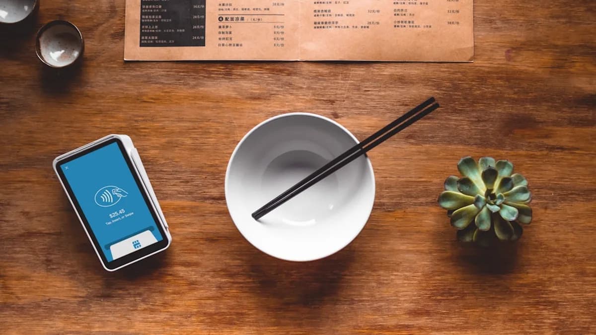 black chopsticks in white ceramic bowl on table