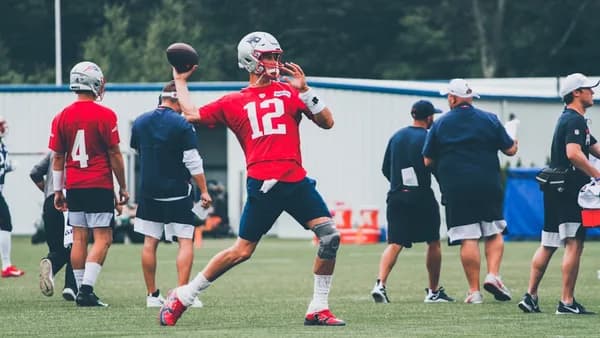 football players in red and white jersey shirt and black shorts