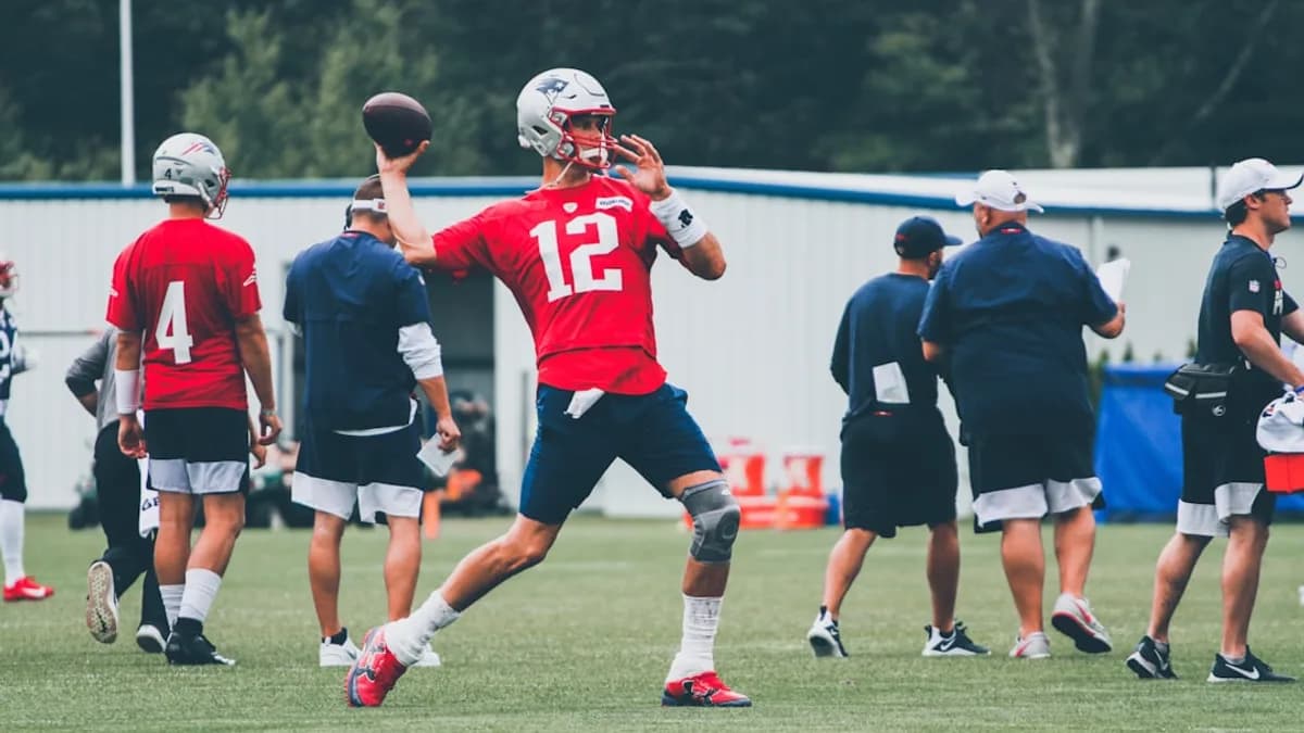 football players in red and white jersey shirt and black shorts