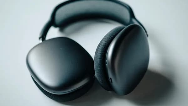 black headphones on white table