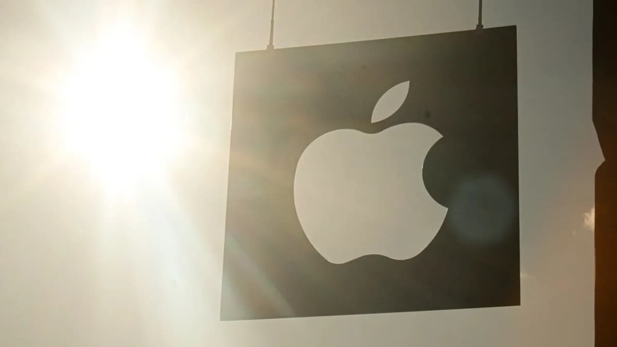a picture of an apple logo hanging on a wall