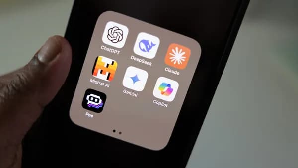 A person holding a smart phone in their hand
