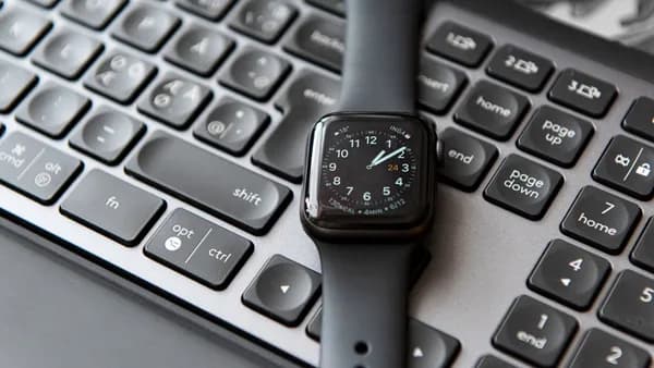 silver and black apple watch at 10 10