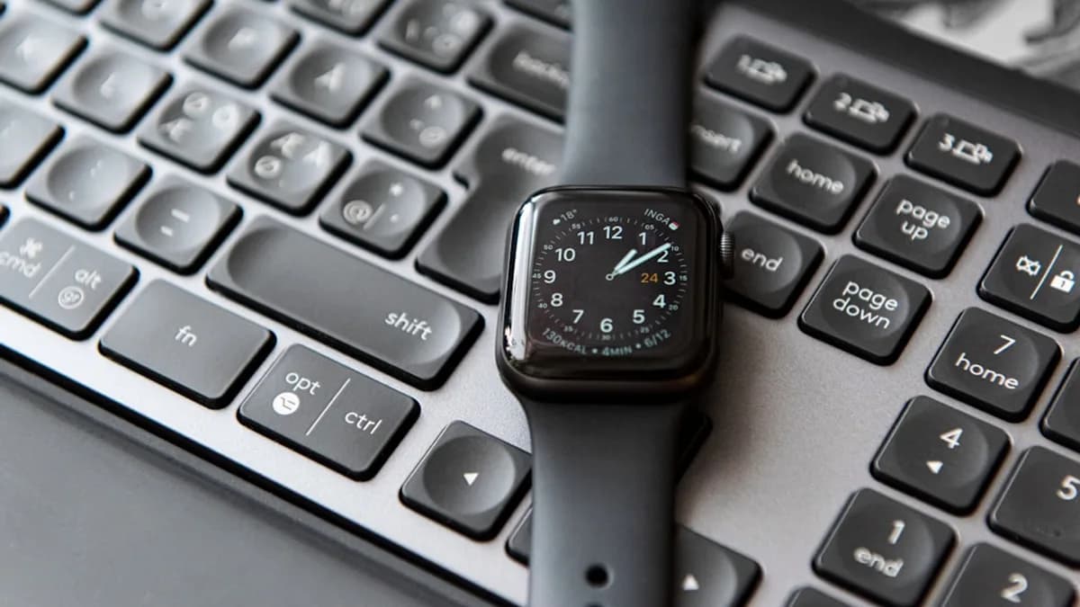 silver and black apple watch at 10 10