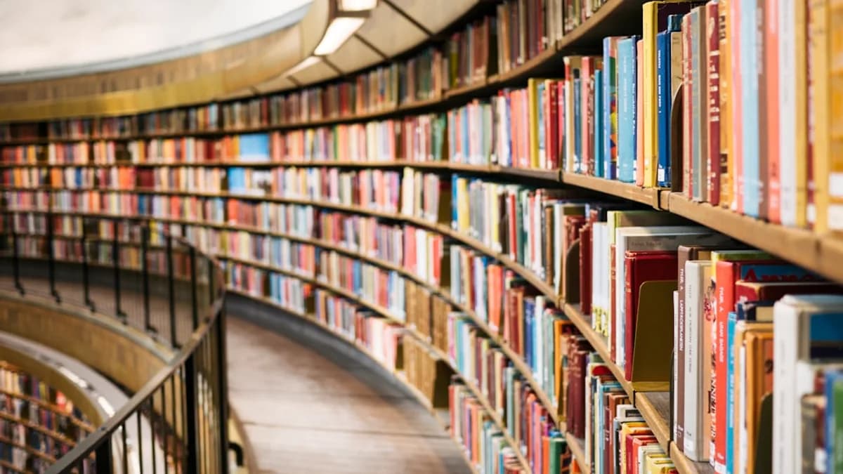 books on brown wooden shelf