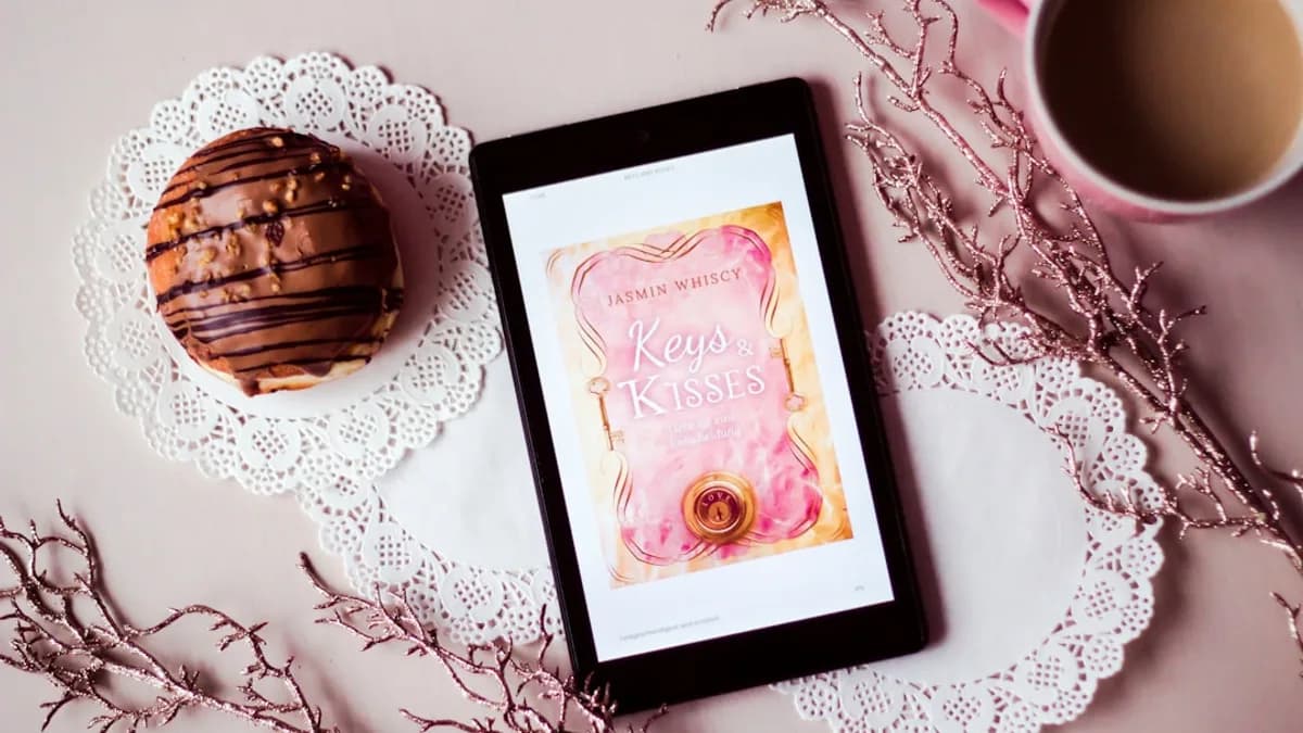 tablet showing Keys Kisses card between filled cup and dessert