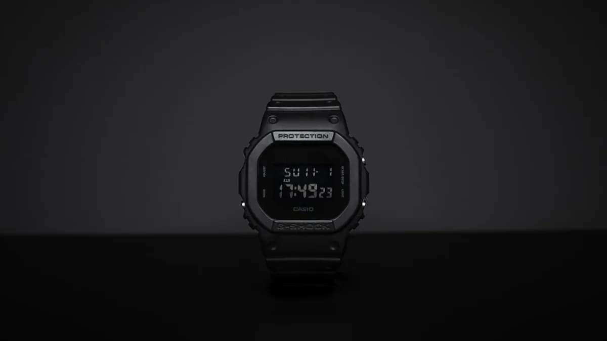black casio digital watch at 11 00